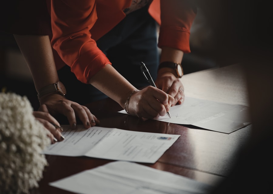 Reviewing and signing paperwork at a desk